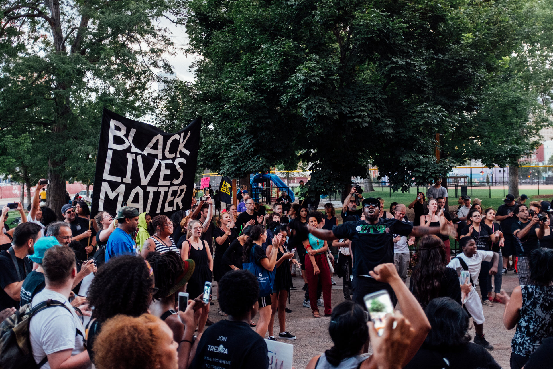 Participants in the BLM 5280 march return to Denver's Sonny Lawson Park to celebrate the conclusion of the peaceful protest.