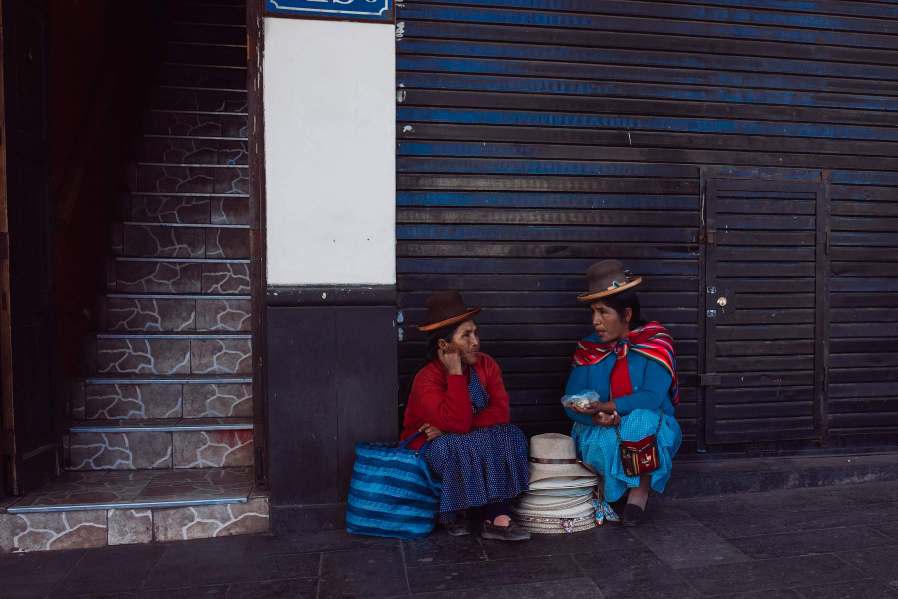 Two woman sharing food and conversation during lunchtime in Arequipa.