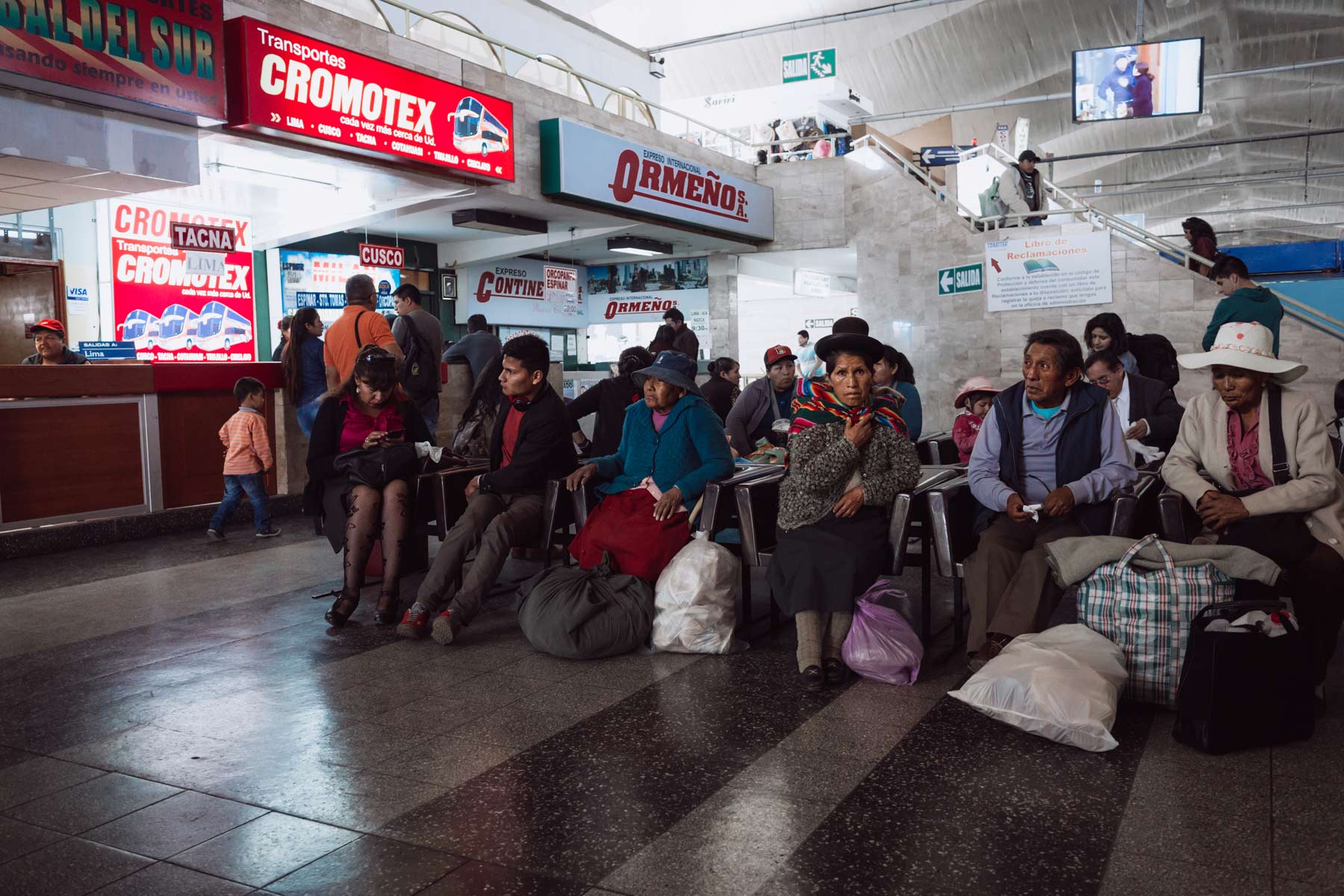 Passengers waiting for their long distance bus in Arequipa.
