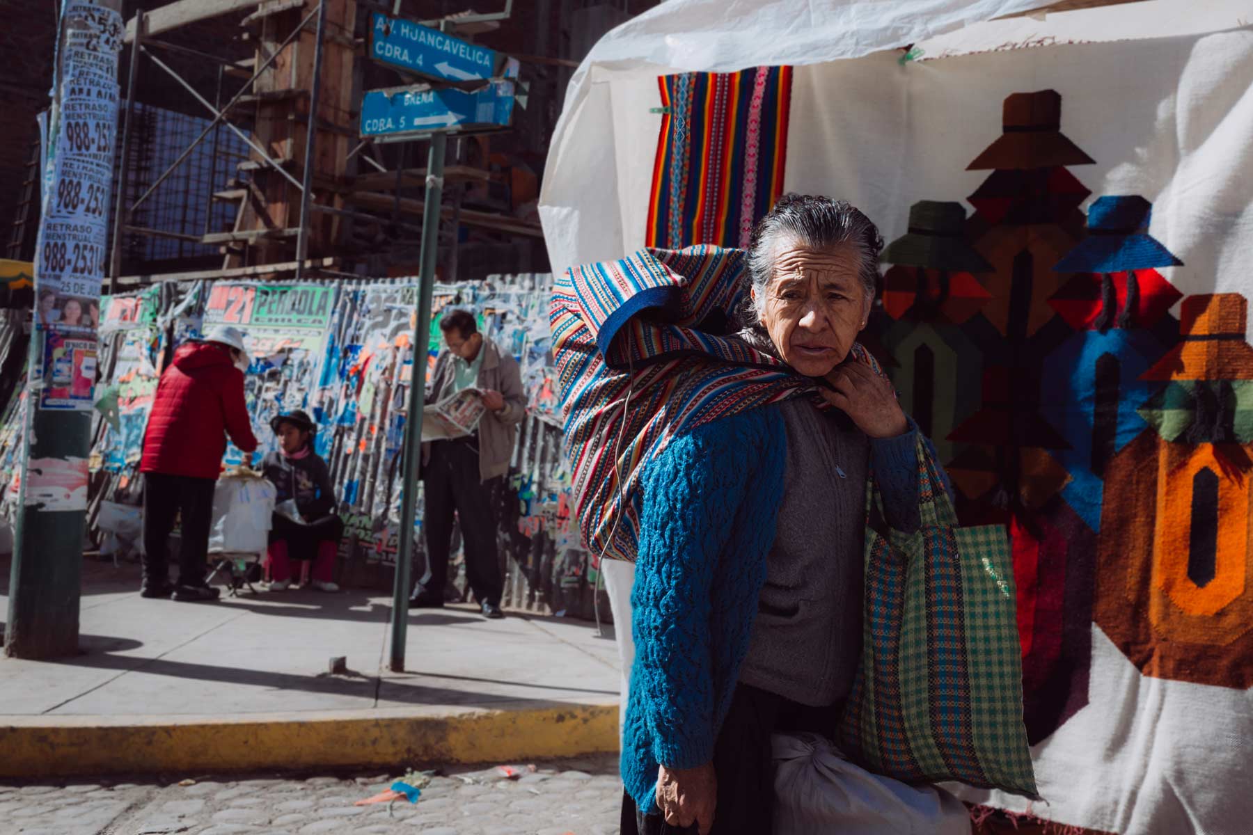 A woman carries goods from a local market in Huancayo.